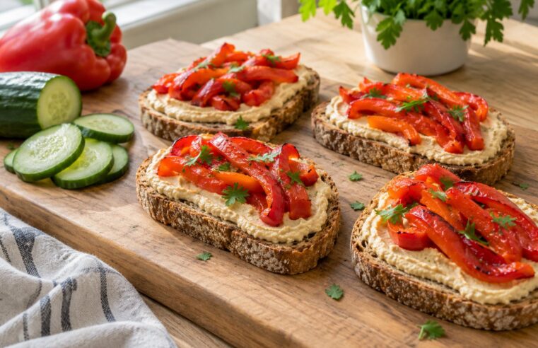 Volkoren boterham met hummus en geroosterde paprika
